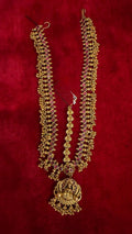 Traditional gold maangteeka with ruby-accented side chains