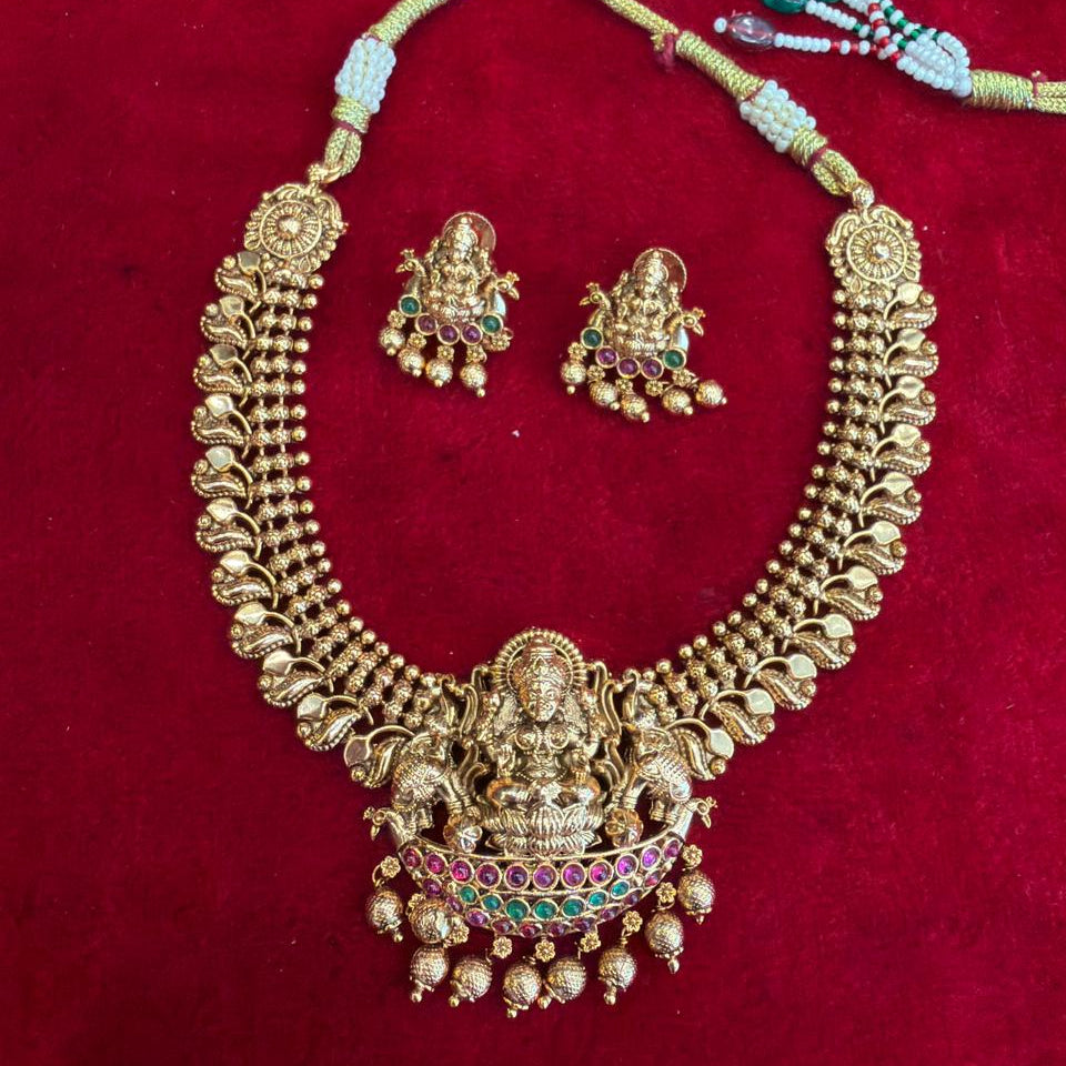 Traditional gold-tone temple jewellery set with a Lakshmi pendant
