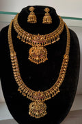Traditional bridal jewelry set features an antique gold finish with detailed temple-style craftsmanship.