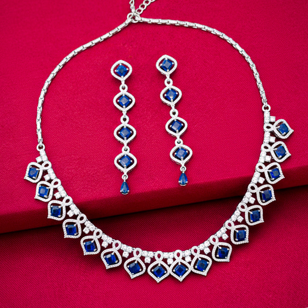 Elegant silver-tone necklace set with matching long earrings.