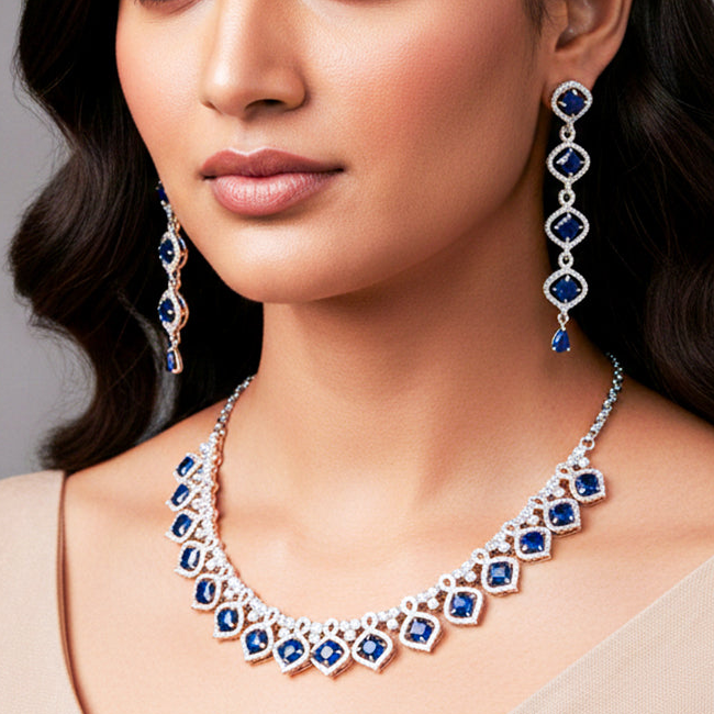 Elegant silver-tone necklace set with matching long earrings.