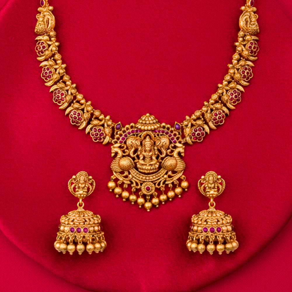 Nakshi-style necklace with a prominent central pendant depicting Goddess Lakshmi, symbolizing prosperity.