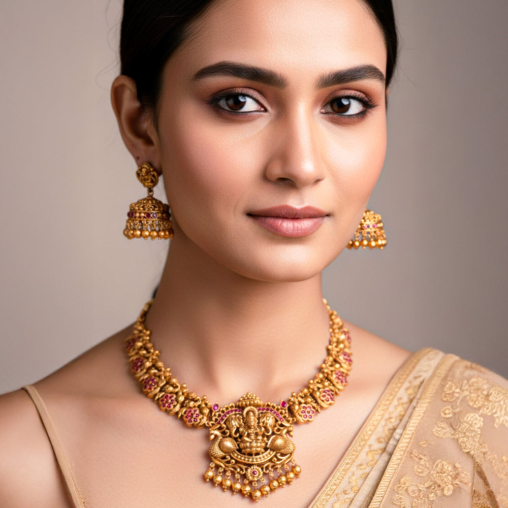 Nakshi-style necklace with a prominent central pendant depicting Goddess Lakshmi, symbolizing prosperity.