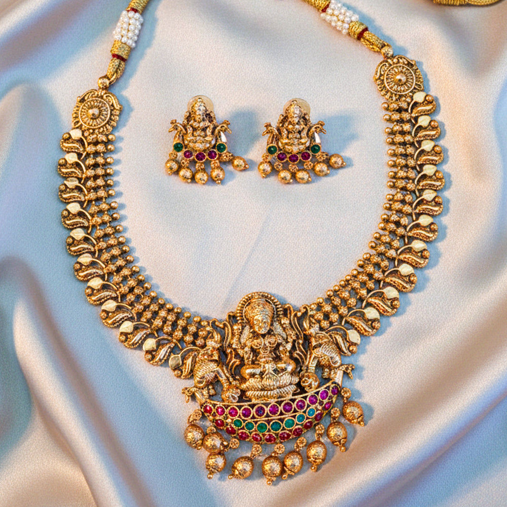 Traditional gold-tone temple jewellery set with a Lakshmi pendant