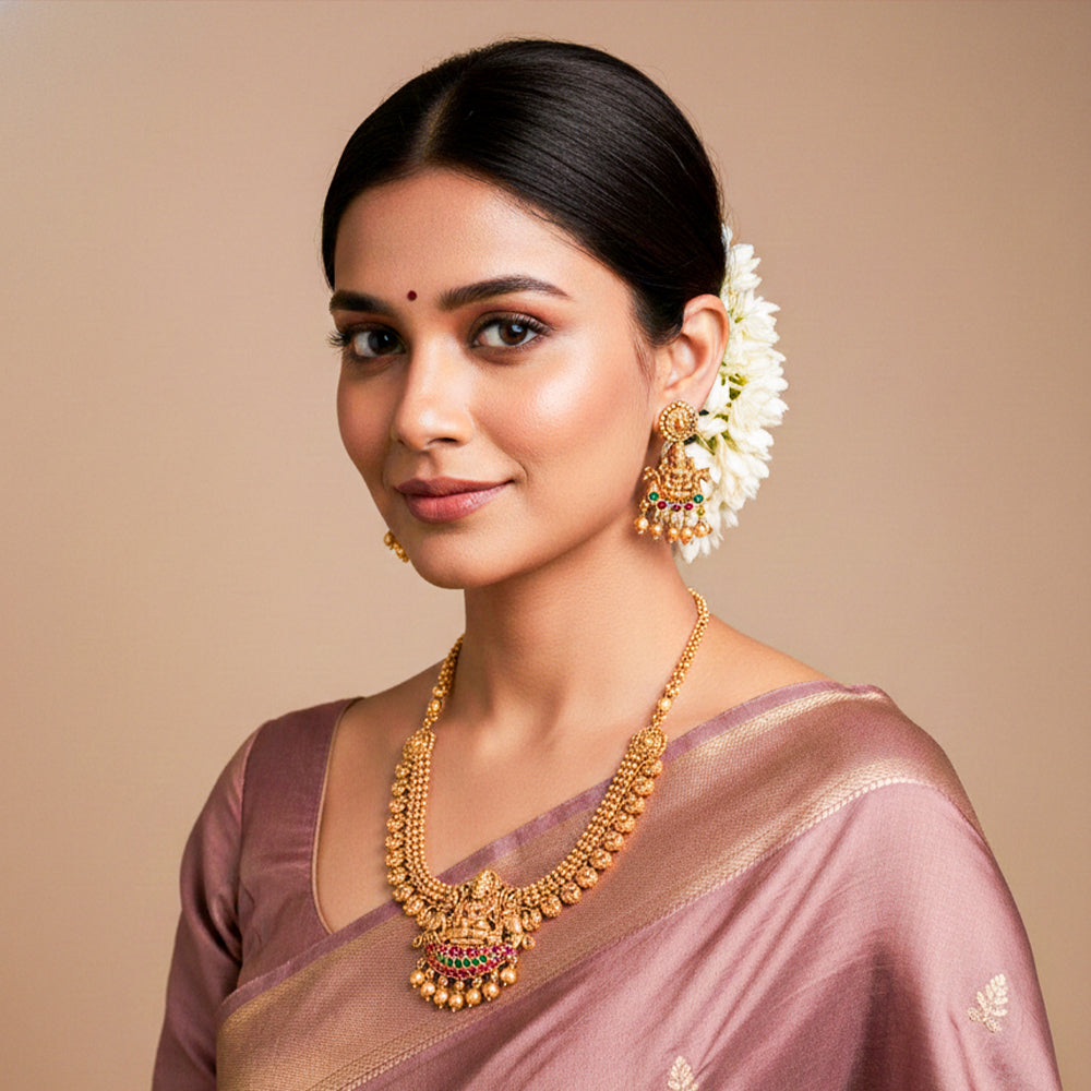 Traditional gold-tone temple jewellery set with a Lakshmi pendant