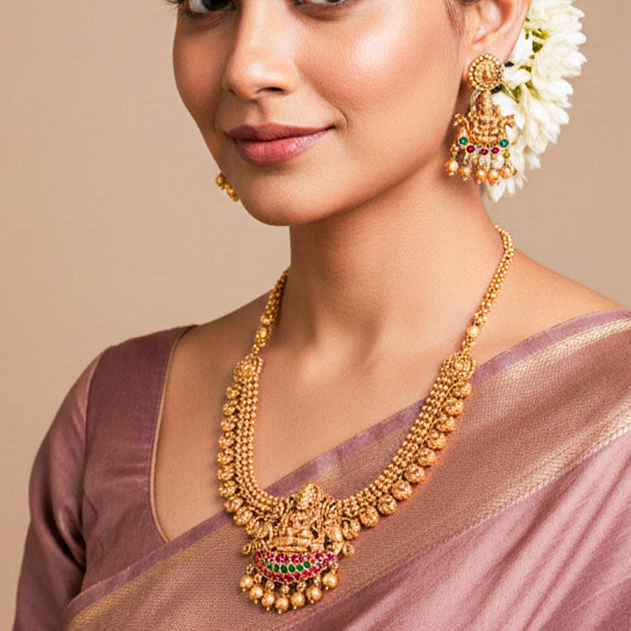 Traditional gold-tone temple jewellery set with a Lakshmi pendant