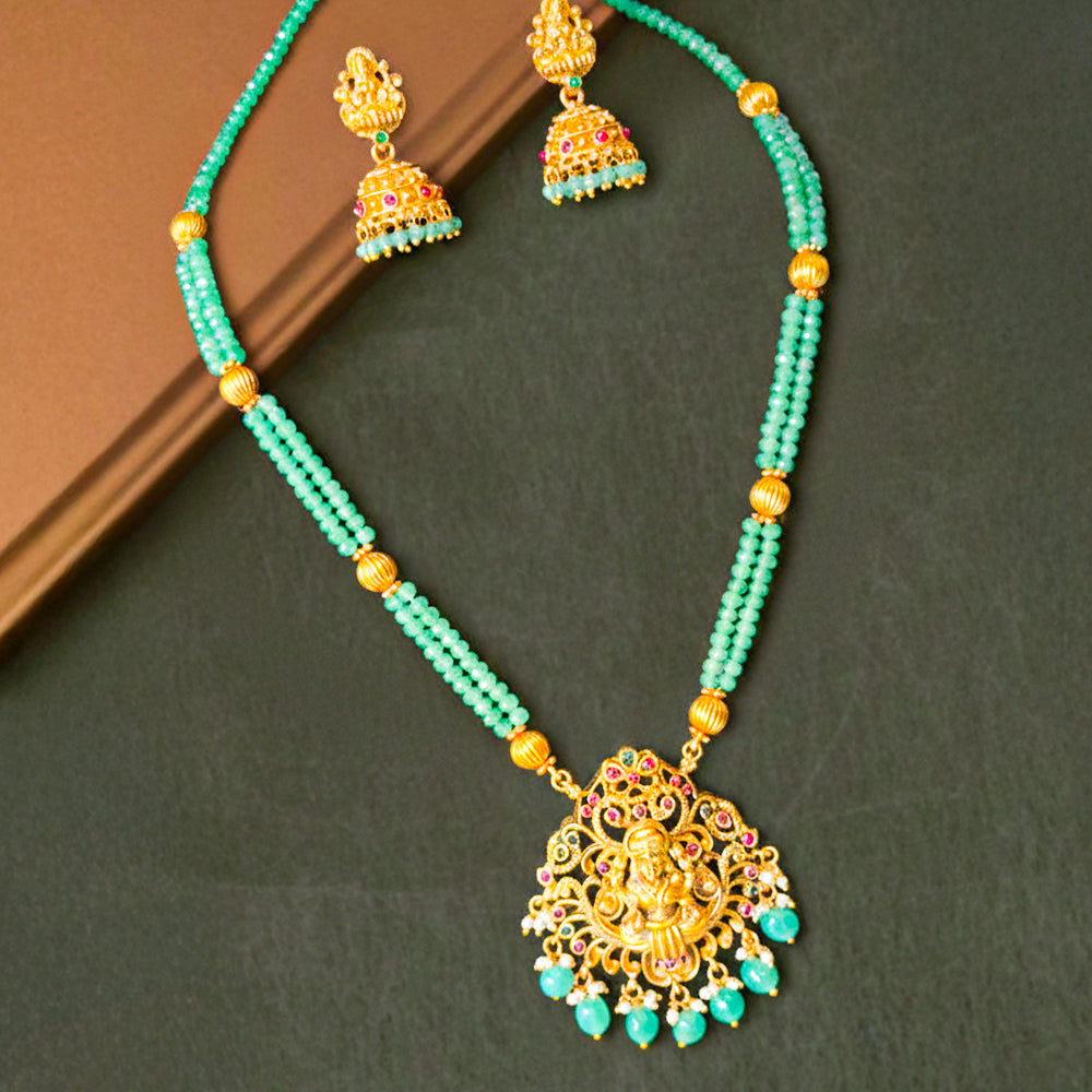 Elegant Temple Jewelry set features a double-strand necklace of mint green beads and an antique gold-finish pendant of Goddess Lakshmi.